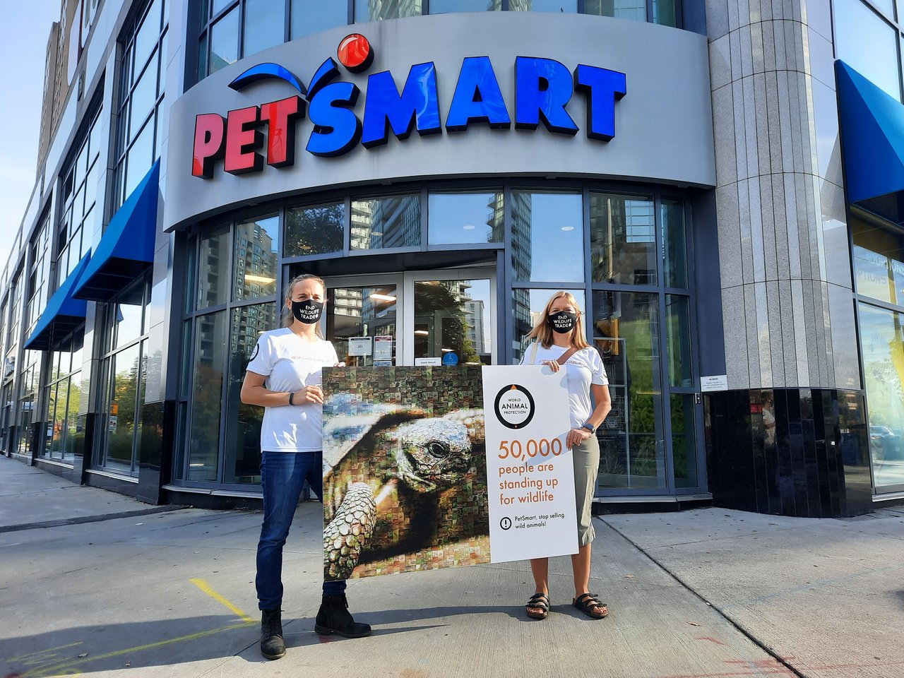 World Animal Protection staff in front of PetSmart with a petition